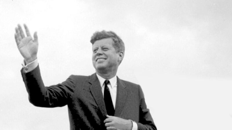 US President John F Kennedy acknowledges the cheers of the crowd when he visits New Ross, Co Wexford in June 1963 