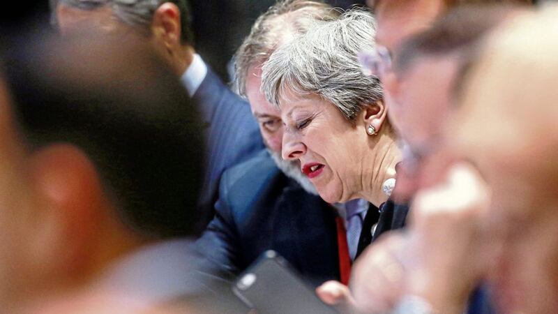 Theresa May at a breakfast meeting at an EU summit in Brussels on Friday PICTURE: Olivier Hoslet, Pool Photo via AP 