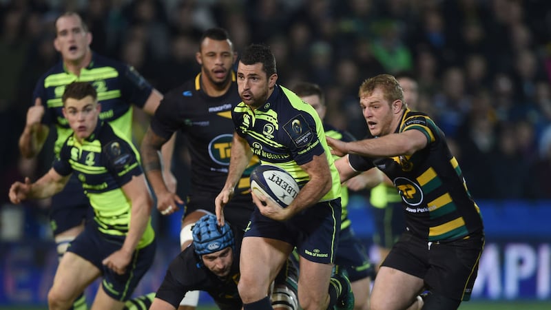 &nbsp;Leinster Rugby's Rob Kearney breaks the tackle of Northampton Saints' Michael Paterson and Mikey Haywood during the European Champions Cup match at Franklin's Gardens. Picture by PA