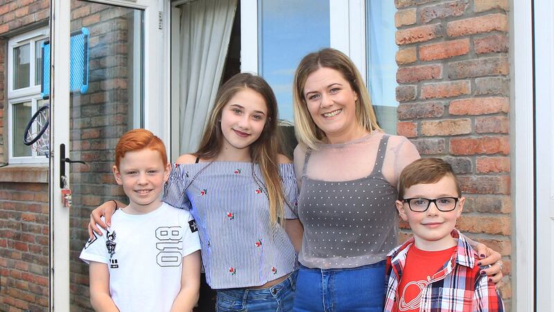 Ballymoney woman Kerri Douglas, seen with her children Mackenzie, Khalyn and Cade, is a carrier of the BRAC2 gene and plans to have preventative surgery to reduce her risk of developing breast cancer<br />Picture: Margaret McLaughlin