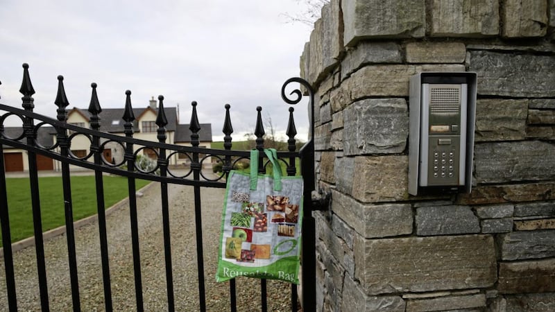 A shopping bag hangs on gates at the Co Down home of Ronald and Hilary Hawthorne, two people named in a new documentary about the Loughinisland massacre 