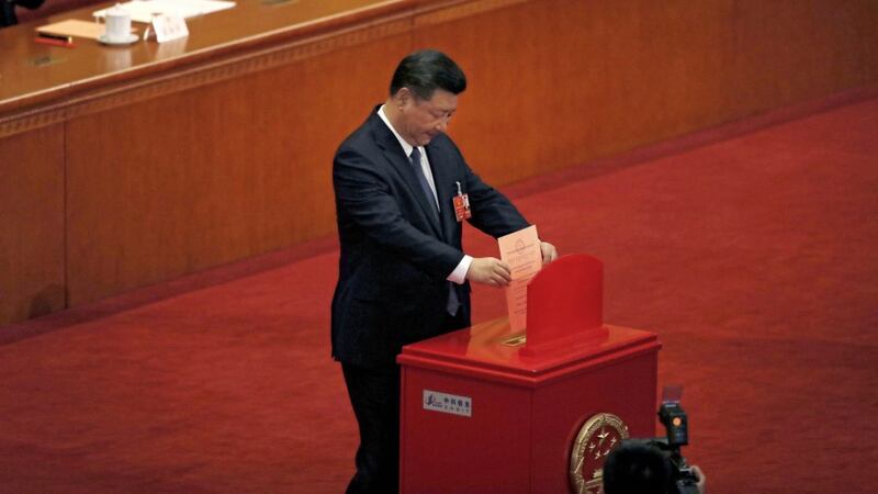 Chinese President Xi Jinping casts his vote for an amendment to China&#39;s constitution that will abolish term limits on the presidency and enable him to rule indefinitely Picture by/Andy Wong/AP 