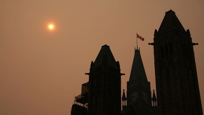 Smoke from wildfires in Ontario and Quebec is shown over Parliament Hill in Ottawa (The Canadian Press via AP)