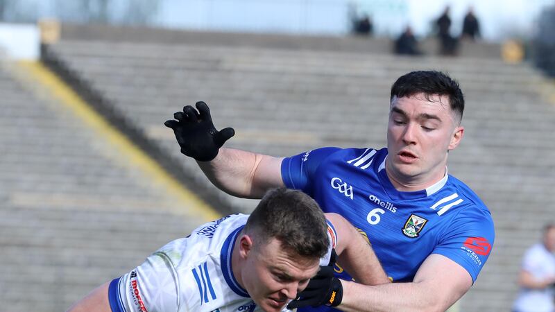 Monaghan's Conor McCarthy and Cavan's Niall Carolan in action